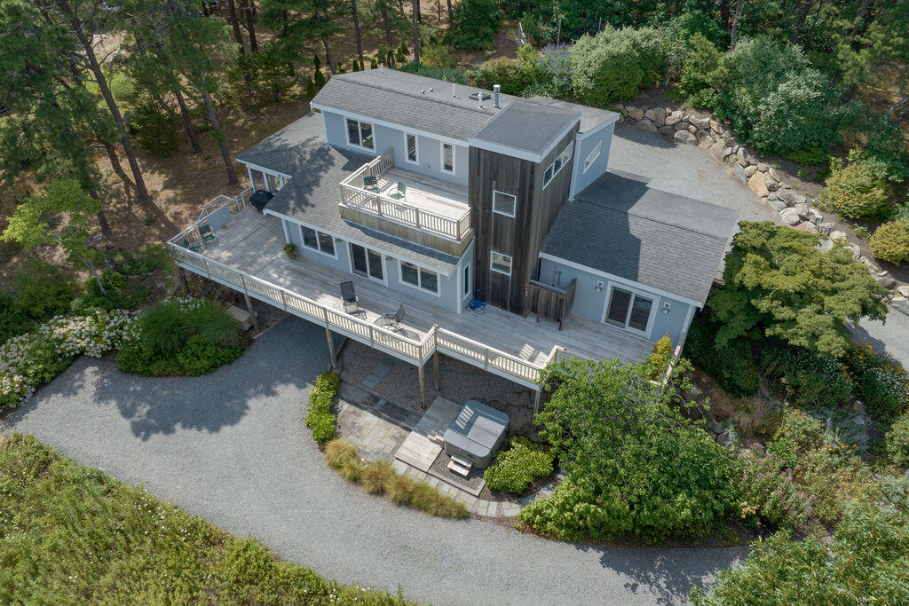 10 Hamblen Farm Road Wellfleet, MA 02667 - Photo 55 of 59 an aerial view of a house with a garden and trees