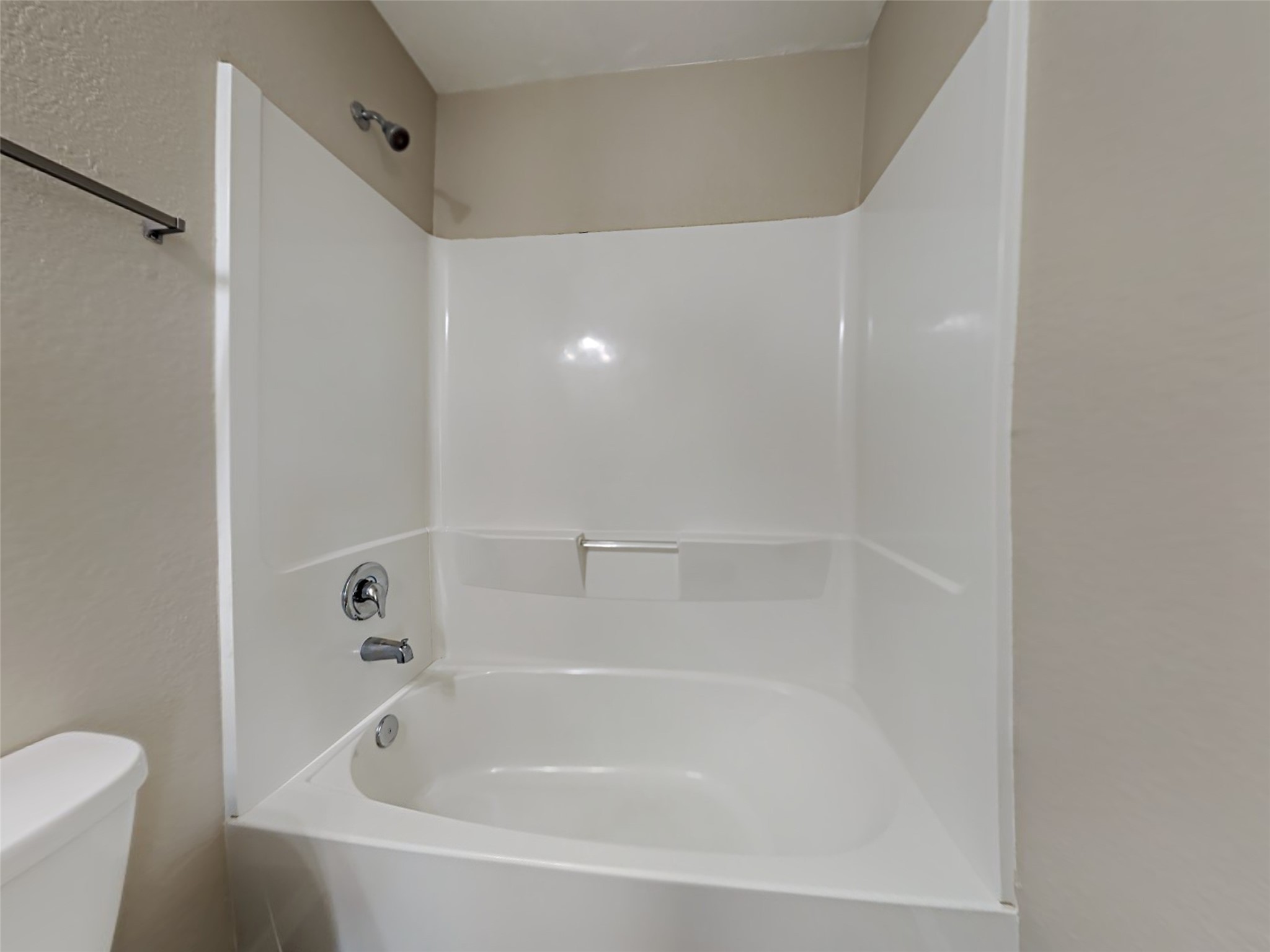15451 Refugio Verde Way Houston, TX 77049 - Photo 13 of 20 a white bath tub sitting next to a white toilet and sink