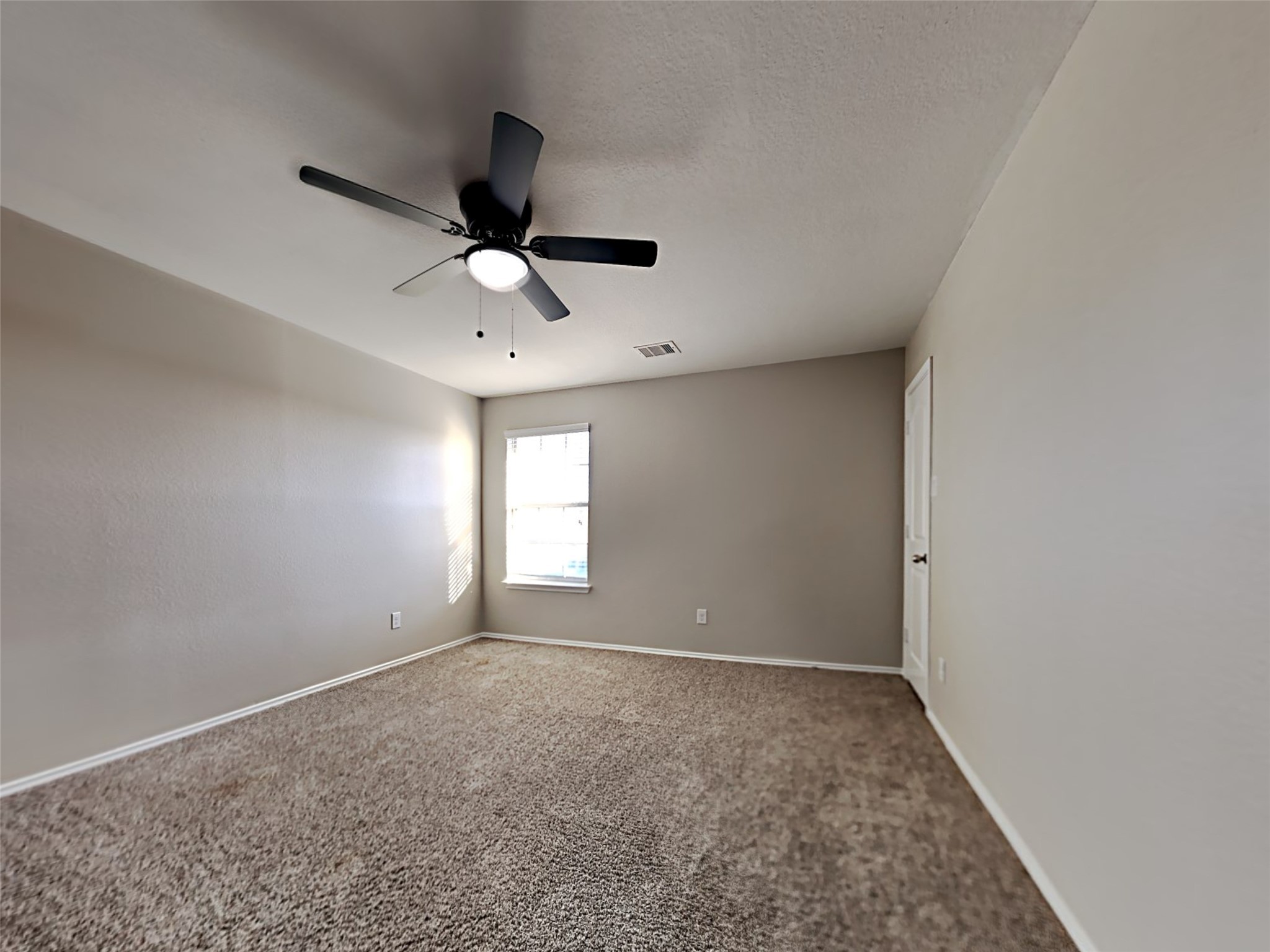 15451 Refugio Verde Way Houston, TX 77049 - Photo 19 of 20 a view of an empty room and window