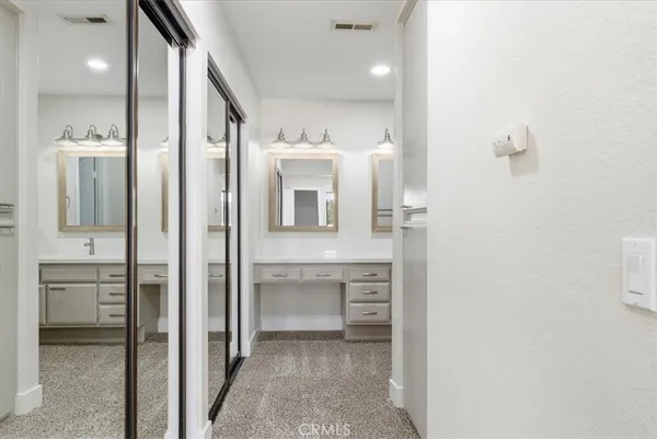 a bathroom with a sink and mirror