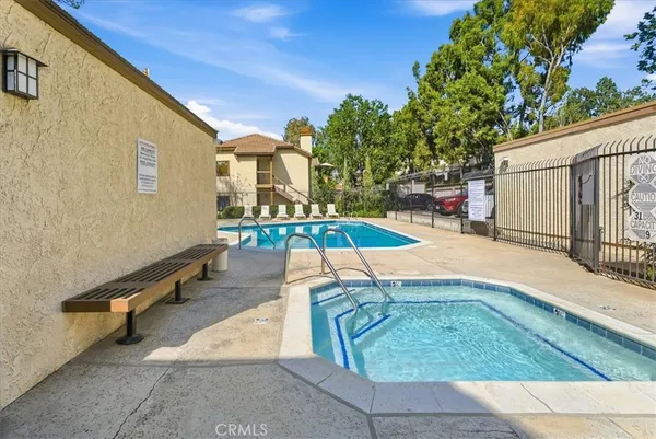 a view of a swimming pool with a lounge chair