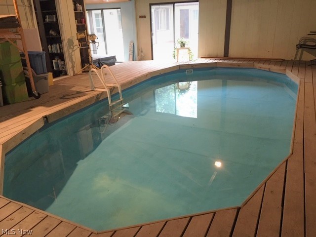 15429 Tavern Road Burton, OH 44021 - Photo 27 of 34 Enjoy the privacy of having your on pool. Glass sliders provide lots of natural light and direct access outside.
