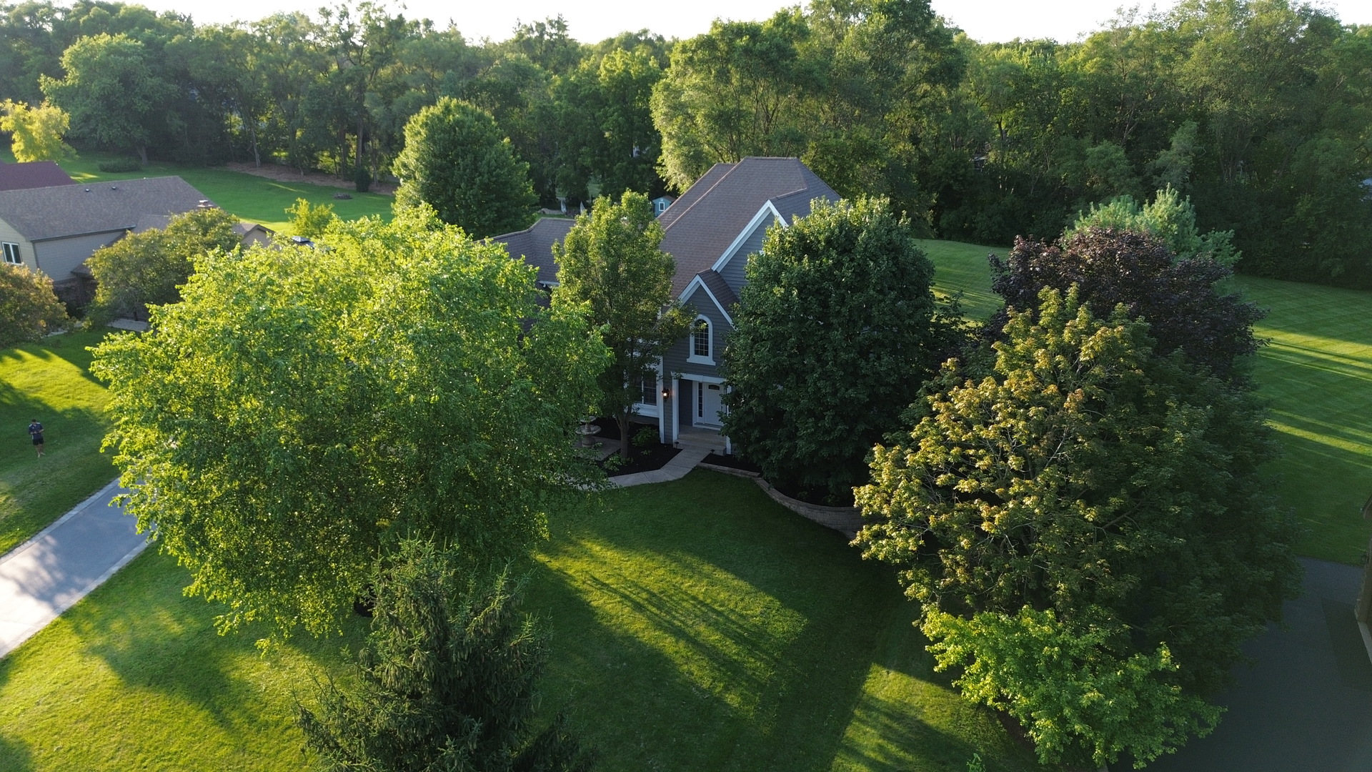28798 Rivers Edge Drive Cary, IL 60013 - Photo 36 of 46 a view of a garden with a building in the background