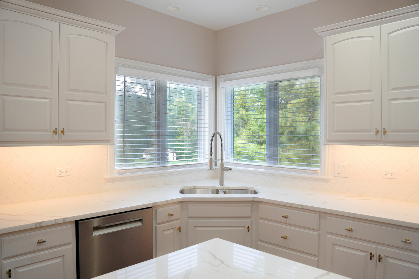 28798 Rivers Edge Drive Cary, IL 60013 - Photo 7 of 46 a kitchen with granite countertop white cabinets and a window