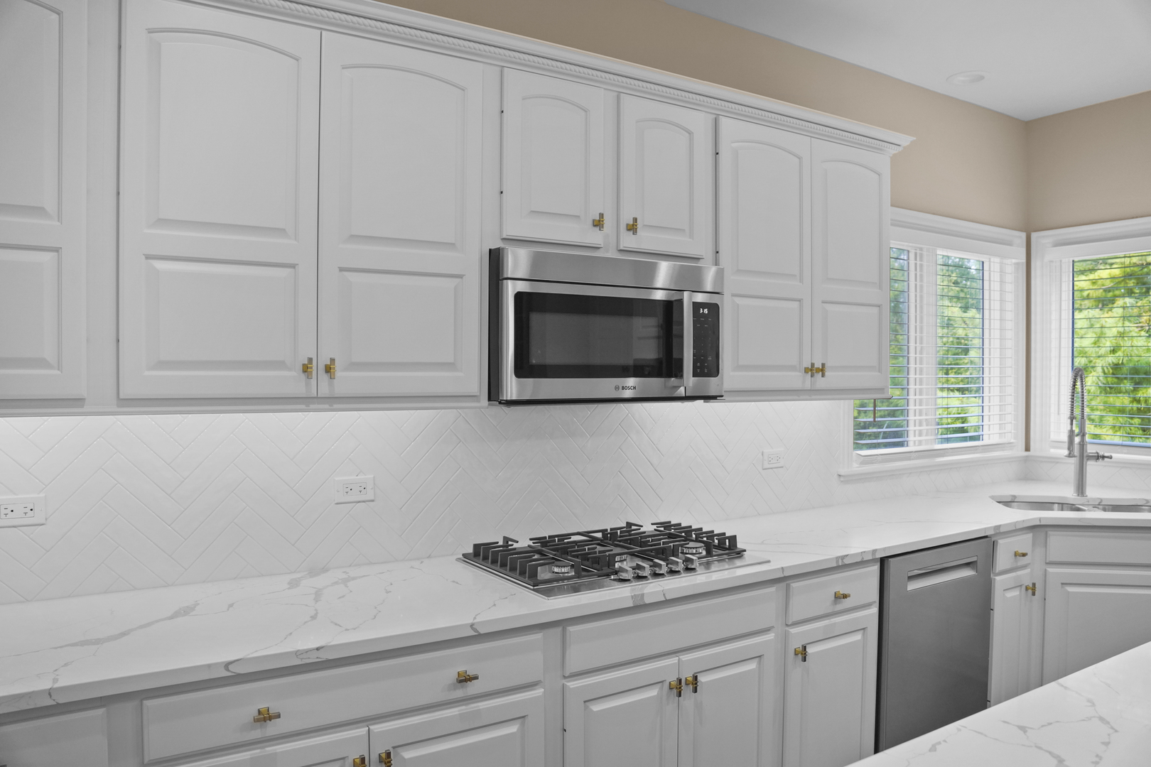 28798 Rivers Edge Drive Cary, IL 60013 - Photo 8 of 46 a kitchen with white cabinets and appliances