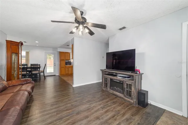 a view of a livingroom with furniture and a flat screen tv