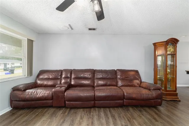 a living room with a couch and a window