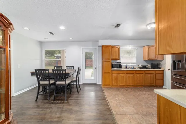 a kitchen with a table and chairs in it