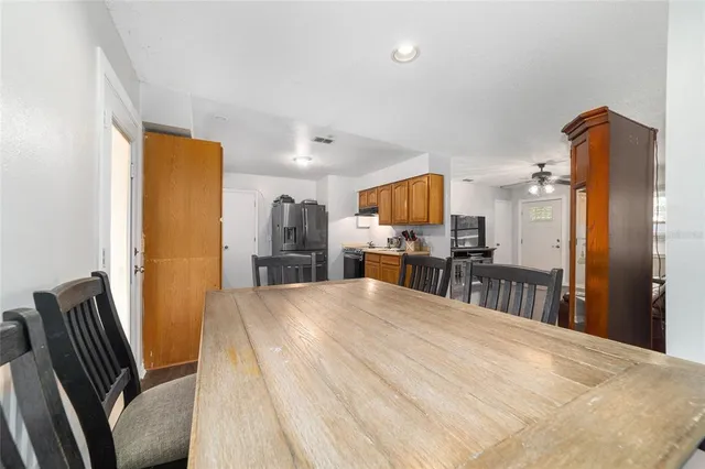 a kitchen with stainless steel appliances granite countertop a refrigerator stove and sink