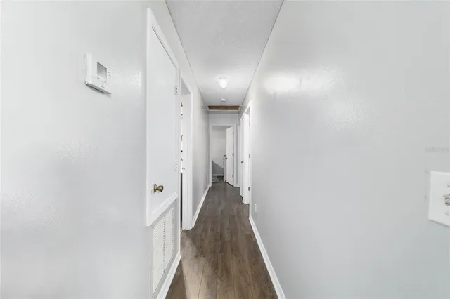 a bedroom with bed couch and window