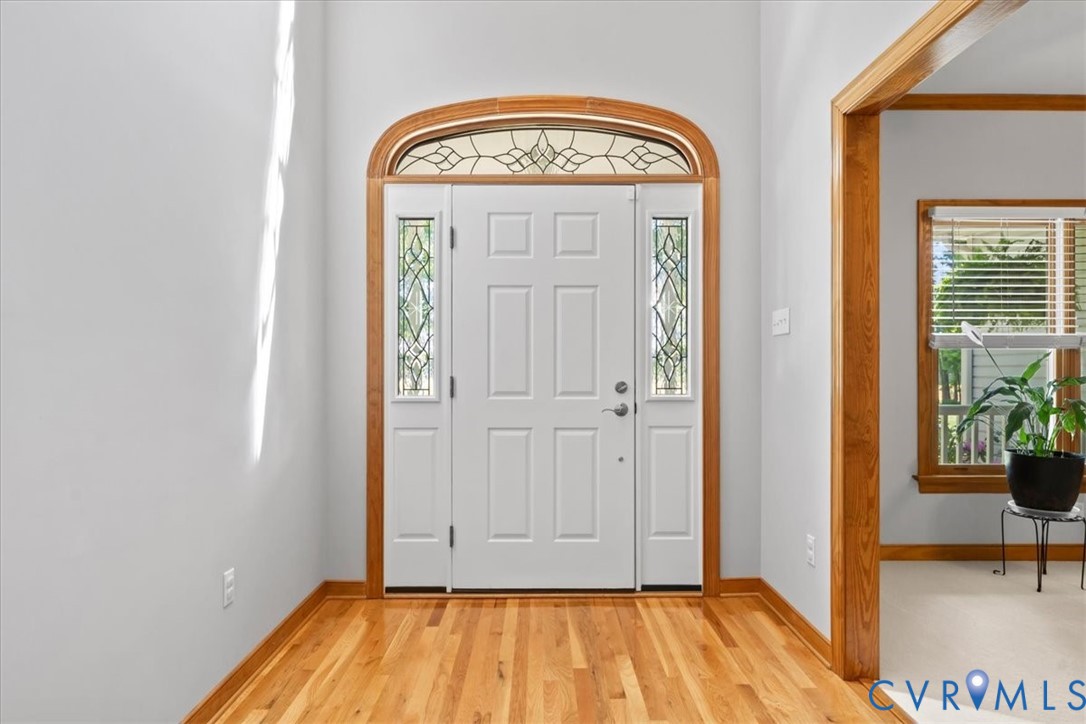 3060 Moyer Road Powhatan, VA 23139 - Photo 12 of 66 Entryway featuring hardwood flooring, a paneled do