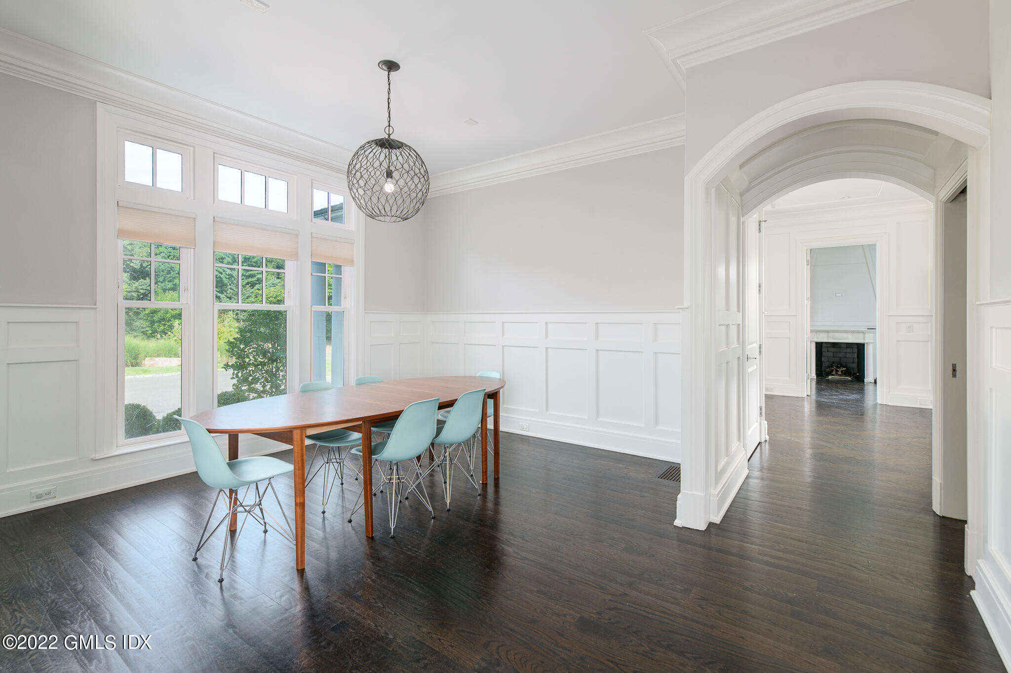311 Stanwich Road Greenwich, CT 06830 - Photo 27 of 65 a view of a dining room with furniture wooden floor and a chandelier