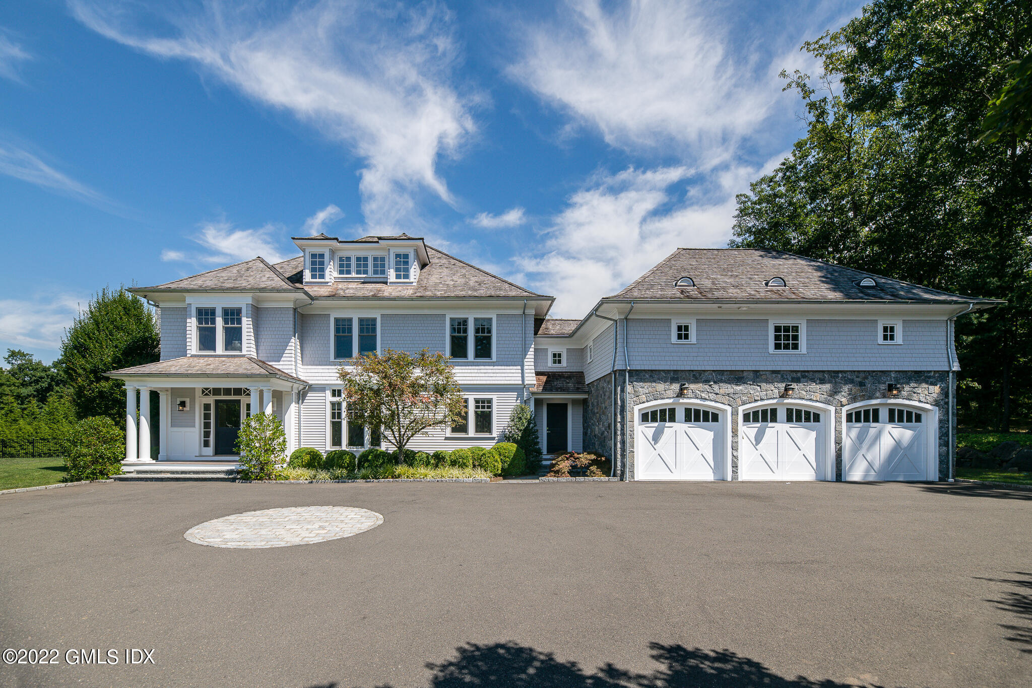 311 Stanwich Road Greenwich, CT 06830 - Photo 3 of 65 a front view of a house with a yard