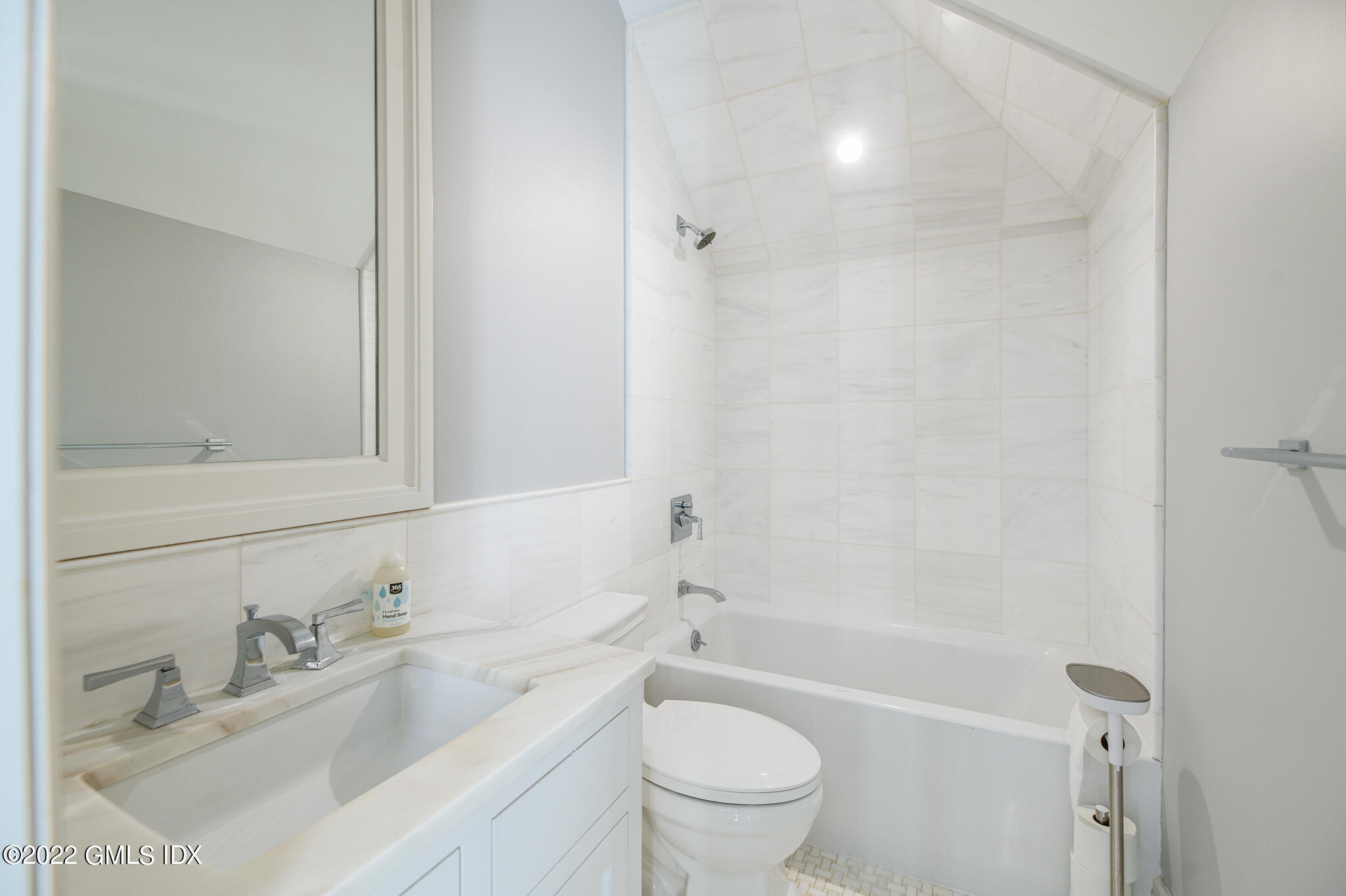 311 Stanwich Road Greenwich, CT 06830 - Photo 41 of 65 a bathroom with a bathtub shower sink vanity mirror and toilet