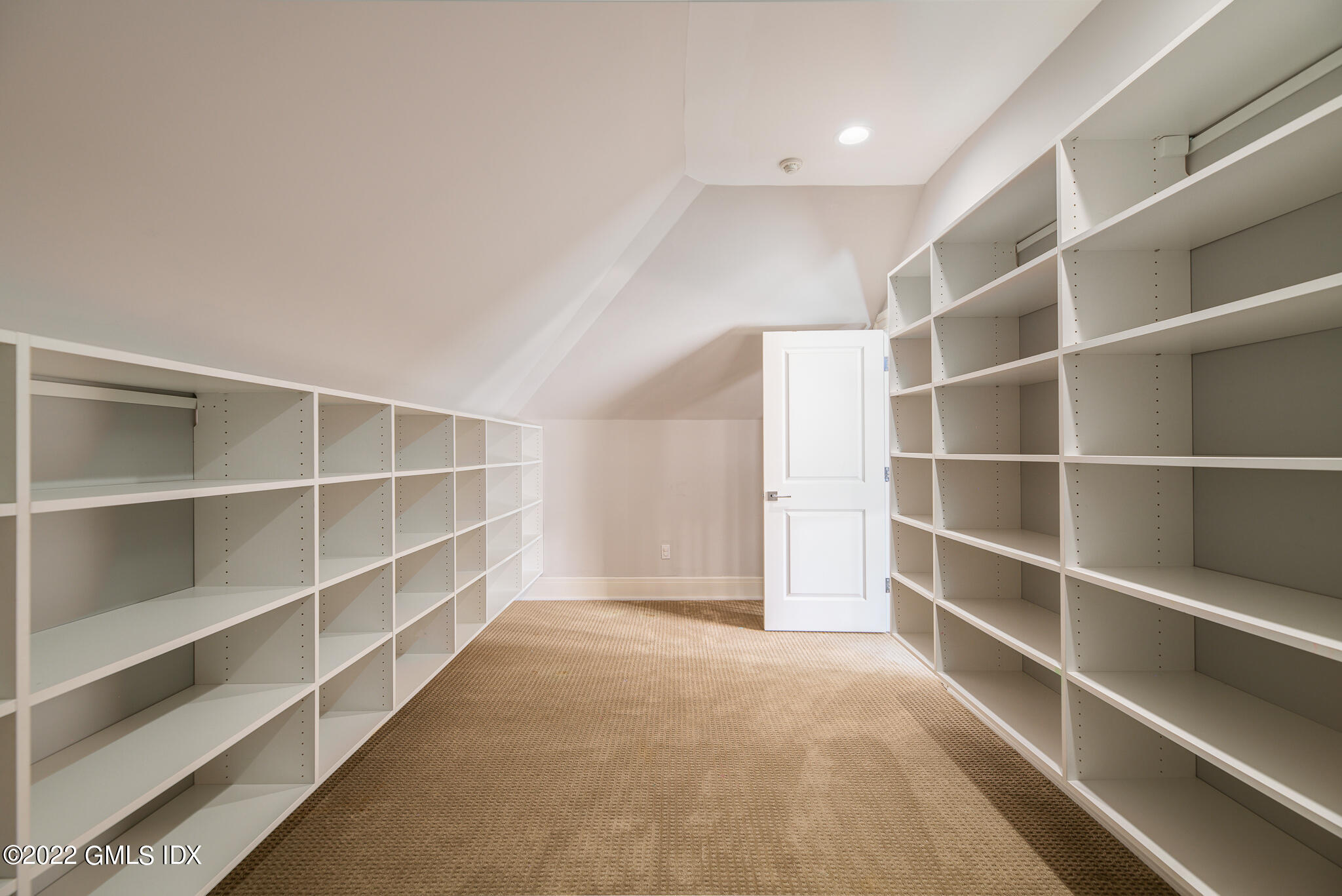 311 Stanwich Road Greenwich, CT 06830 - Photo 44 of 65 a view of an empty room with empty shelves