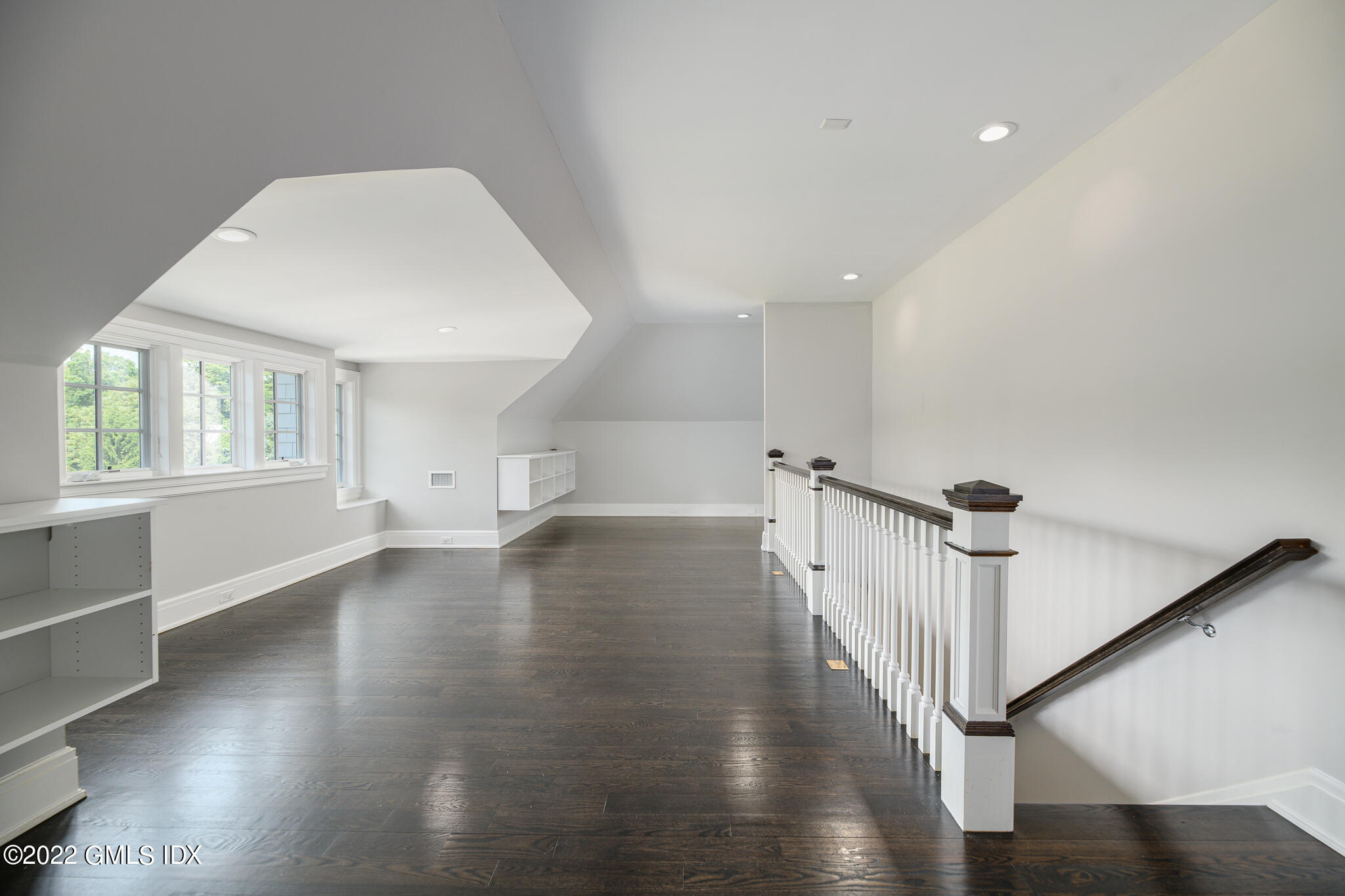 311 Stanwich Road Greenwich, CT 06830 - Photo 45 of 65 a view of empty room with wooden floor and fan