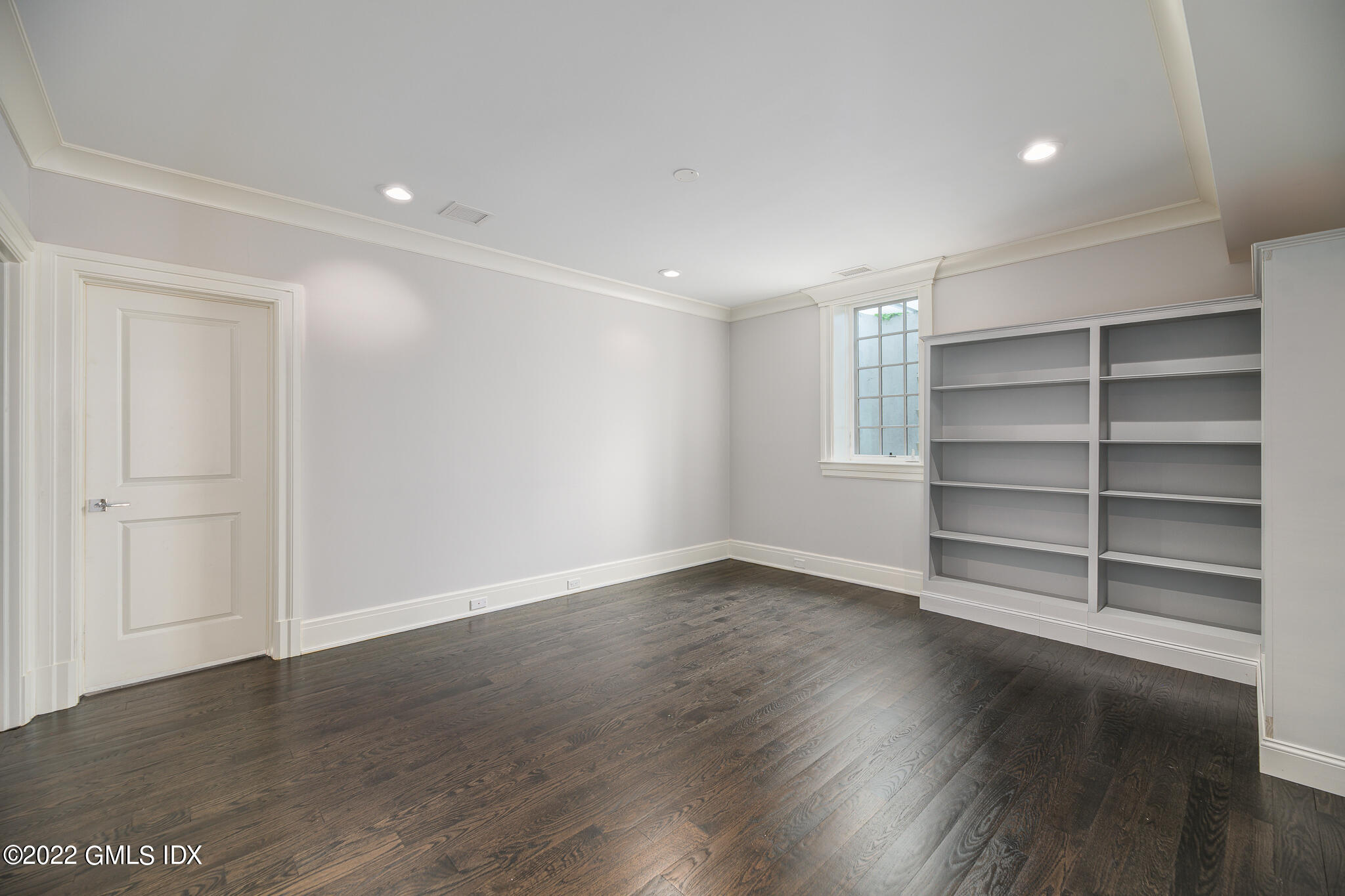 311 Stanwich Road Greenwich, CT 06830 - Photo 49 of 65 a view of an empty room with a closet and wooden floor