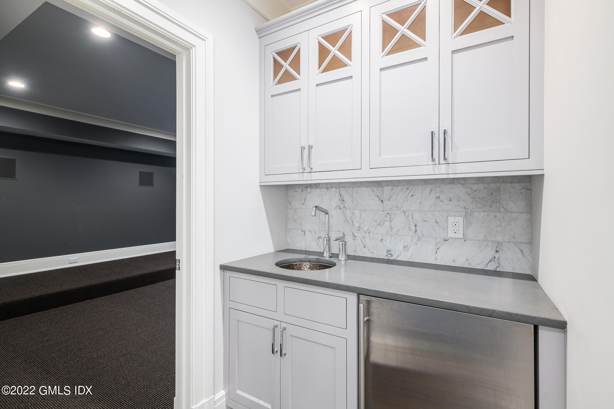 311 Stanwich Road Greenwich, CT 06830 - Photo 53 of 65 a kitchen with a sink and cabinets