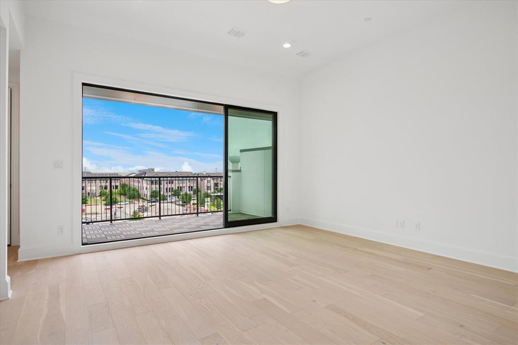 4080 Oak Street Addison, TX 75001 - Photo 5 of 19 an empty room with floor to ceiling window and an outdoor view