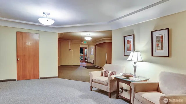 a living room with furniture and a lamp