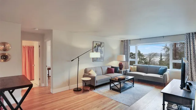 a living room with furniture and a large window