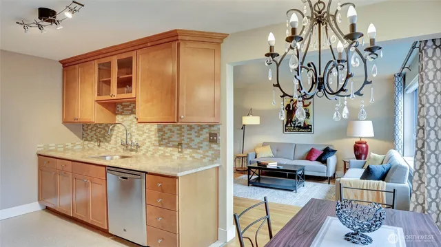 a living room with furniture and flowers