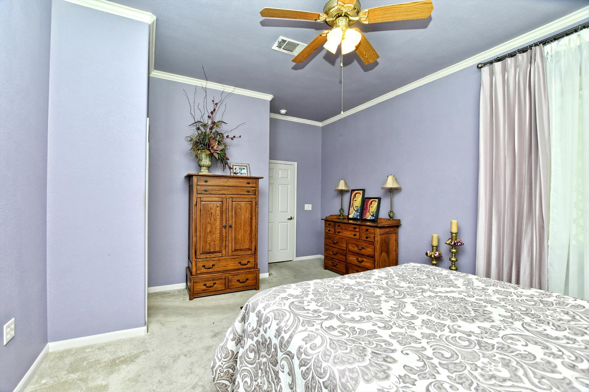 106 Nighthawk Way Georgetown, TX 78633 - Photo 15 of 29 Relax in this tranquil bedroom, featuring a warm ceiling fan and plush carpet flooring.