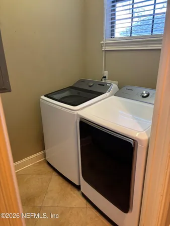 a utility room with dryer and washer