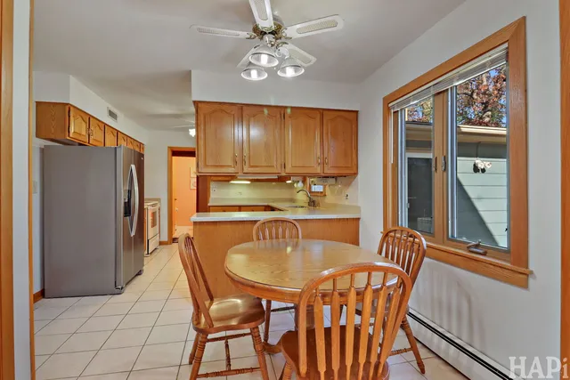 a dining room with furniture and window