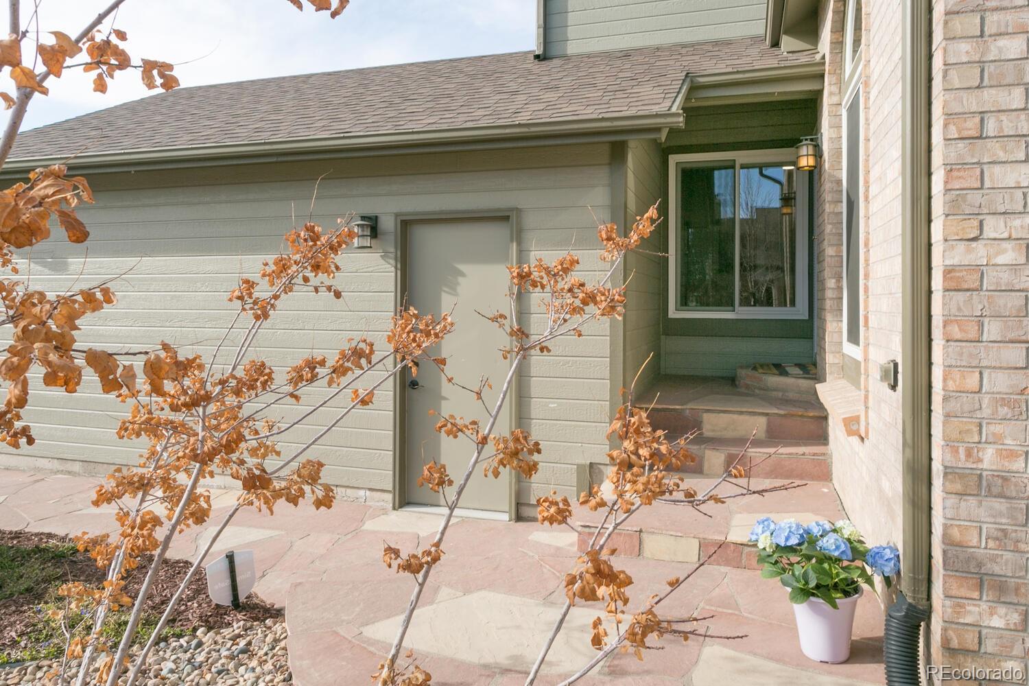 609 James Street Highlands Ranch, CO 80126 - Photo 3 of 30 a front view of a house