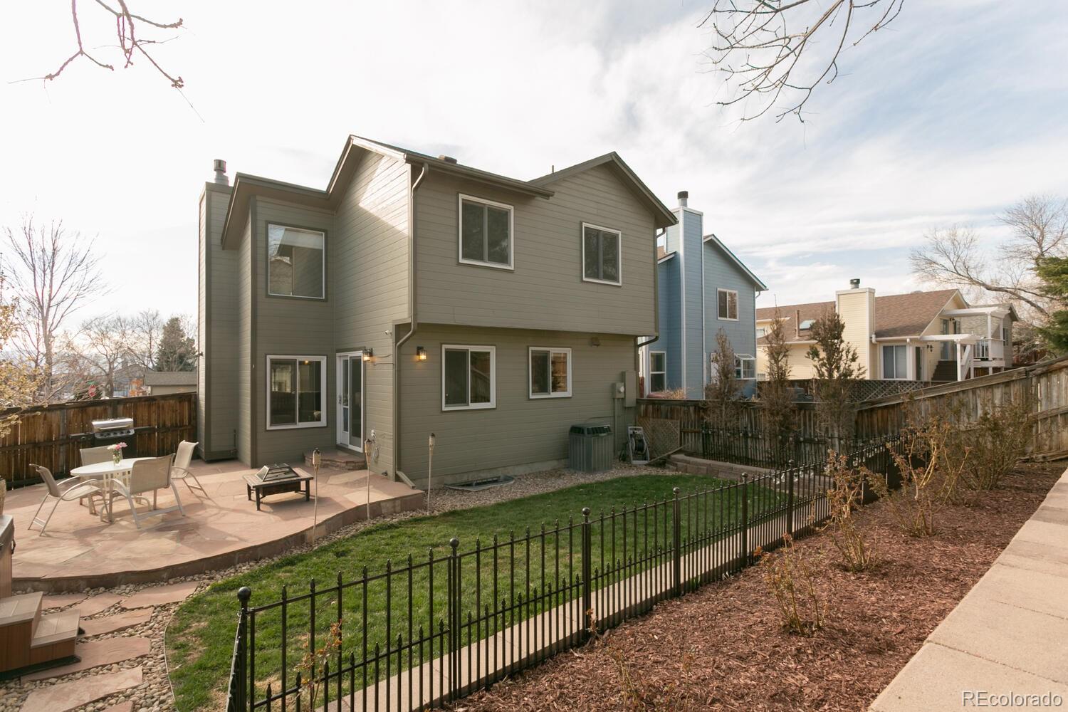 609 James Street Highlands Ranch, CO 80126 - Photo 8 of 30 a front view of a house with a yard