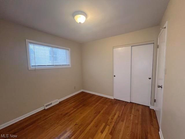 11701 Fordham Road Garfield Heights, OH 44125 - Photo 9 of 19 bedroom #3 freshly painted, offers ample closet space and natural hardwood floor.