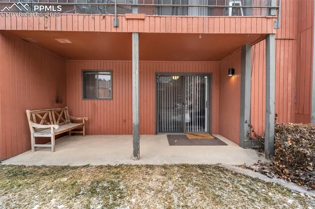 a backyard of a house with a yard and seating space