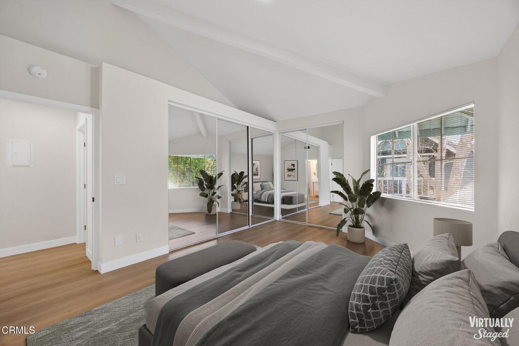1948 Rory Lane, Unit 5 Simi Valley, CA 93063 - Photo 13 of 25 a spacious bedroom with a large window and a wooden floor