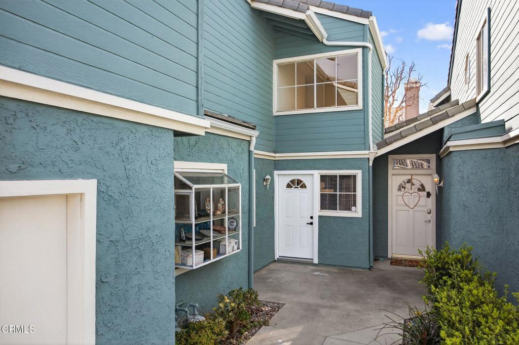 1948 Rory Lane, Unit 5 Simi Valley, CA 93063 - Photo 2 of 25 a front view of a house with a garage