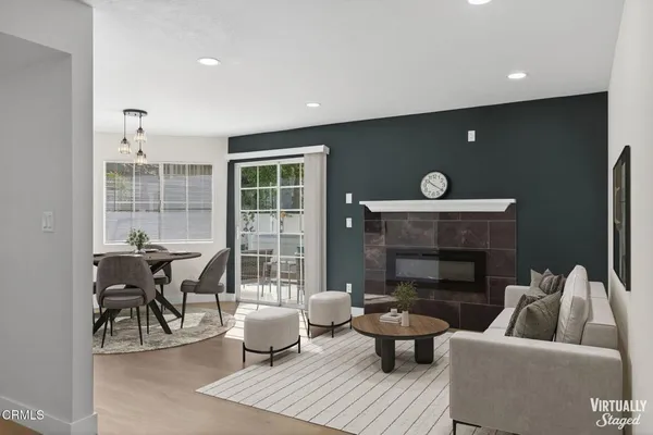 a living room with furniture and a fireplace