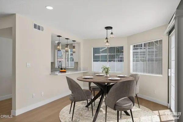 a view of a dining room with furniture window and outside view