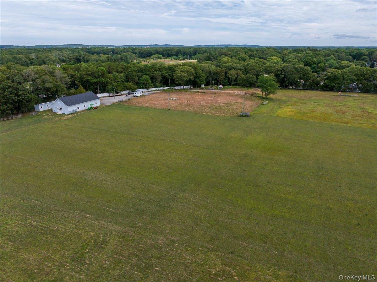 1535 Middle Road Calverton, NY 11933 - Photo 5 of 14 a view of a lake with houses in the background