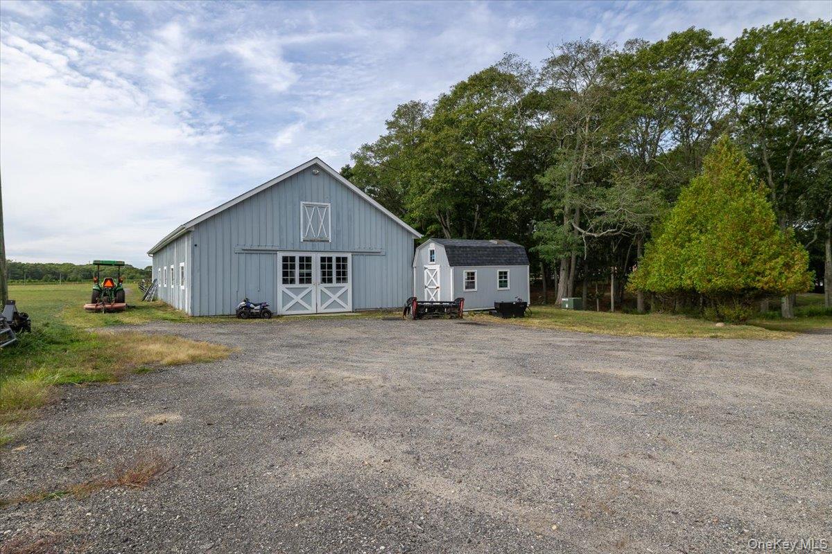 1535 Middle Road Calverton, NY 11933 - Photo 8 of 14 a view of a house with backyard and trees