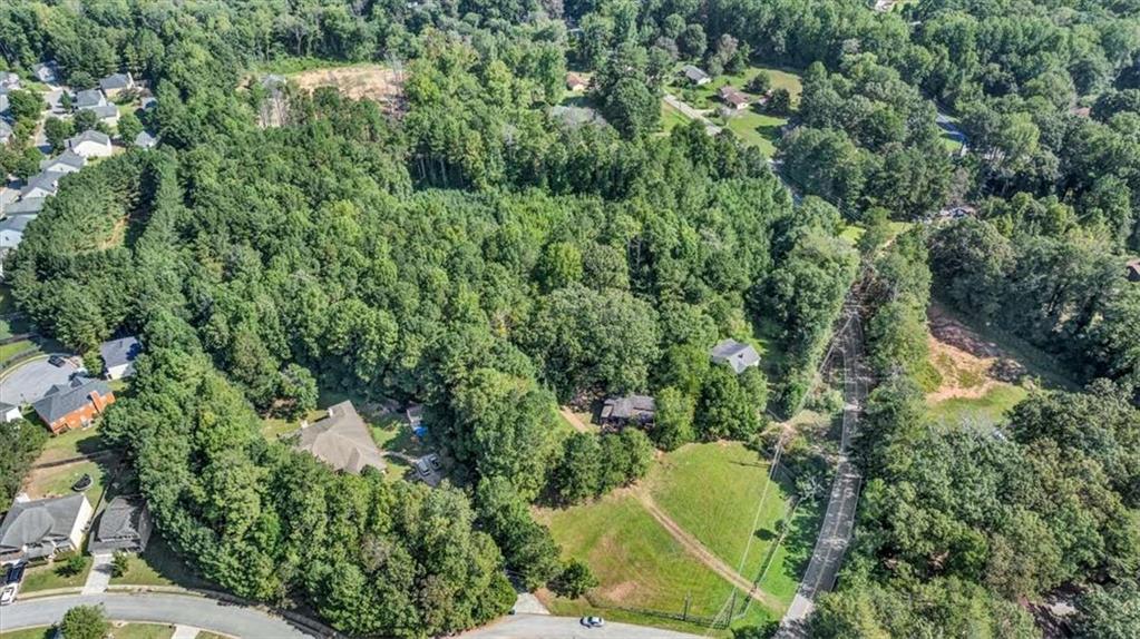 6765 Dagenhart Road Atlanta, GA 30349 - Photo 13 of 27 an aerial view of residential house with outdoor space and trees all around