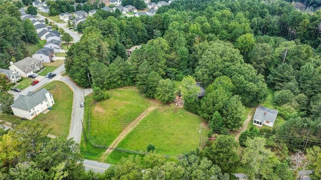 6765 Dagenhart Road Atlanta, GA 30349 - Photo 19 of 27 an aerial view of residential house with outdoor space and trees all around