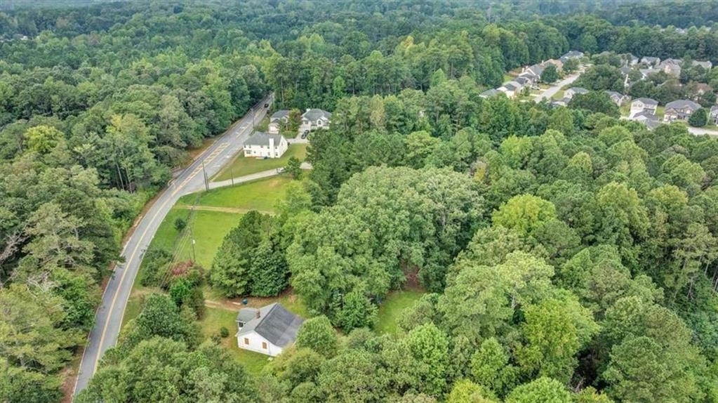 6765 Dagenhart Road Atlanta, GA 30349 - Photo 21 of 27 an aerial view of a house with a yard