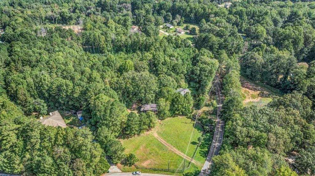 6765 Dagenhart Road Atlanta, GA 30349 - Photo 10 of 27 an aerial view of a house with a yard and swimming pool