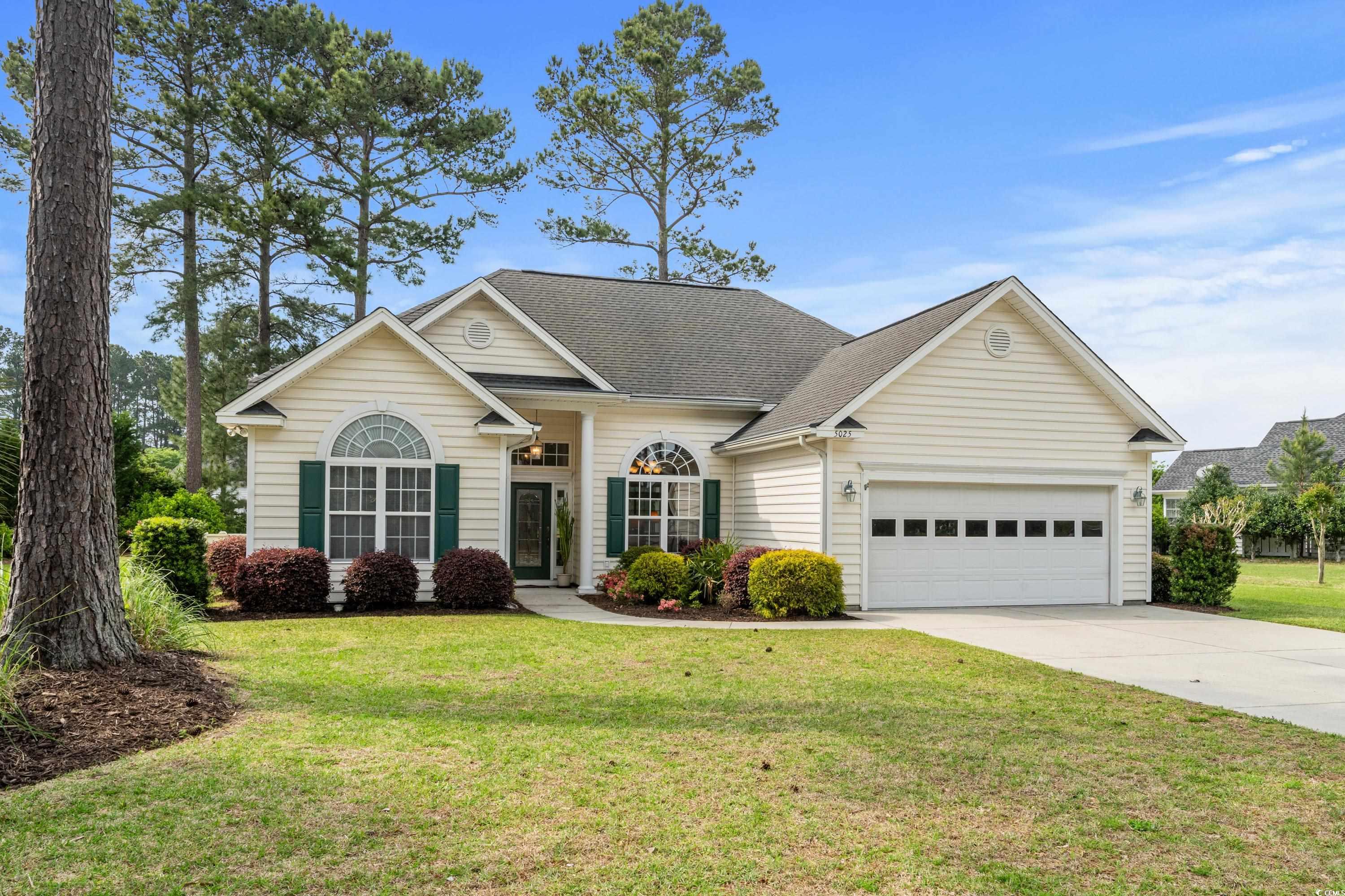 View of front of property with an attached garage,