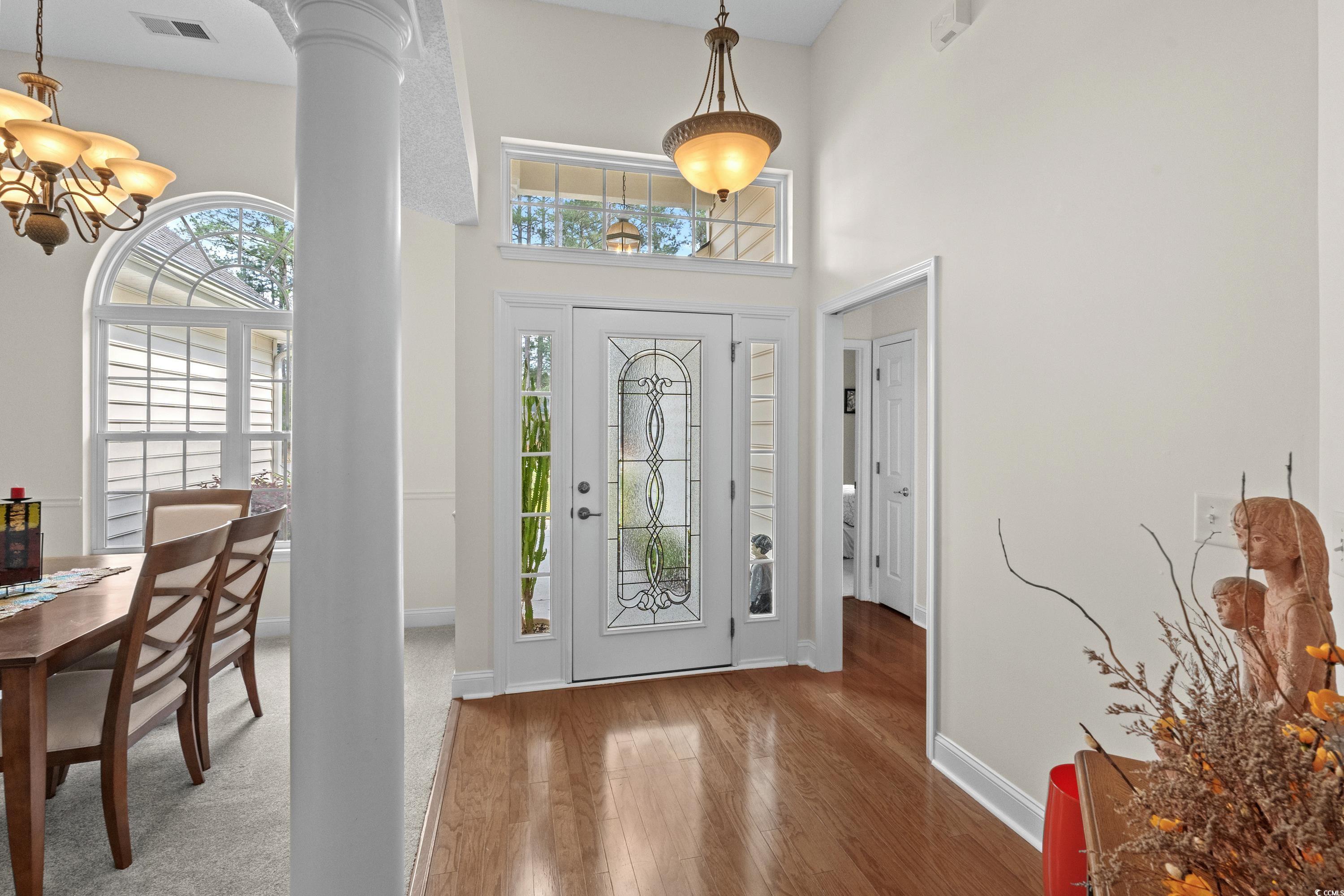 5025 Westwind Drive Myrtle Beach, SC 29579 - Photo 12 of 36 Foyer with visible vents, baseboards, a notable ch