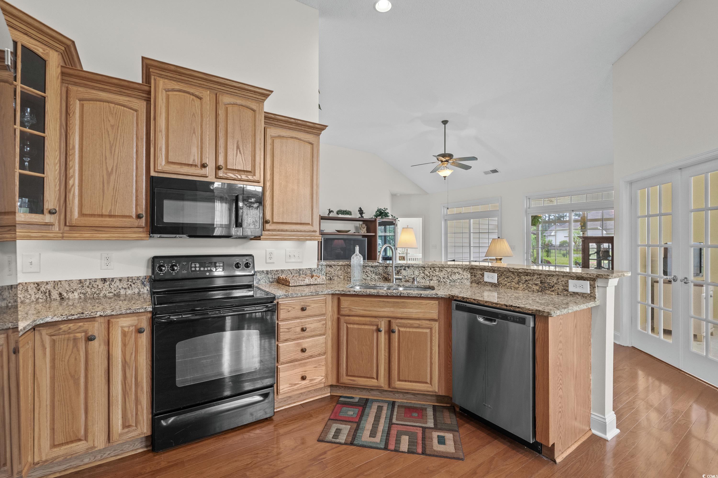 5025 Westwind Drive Myrtle Beach, SC 29579 - Photo 16 of 36 Kitchen featuring a peninsula, black appliances, c