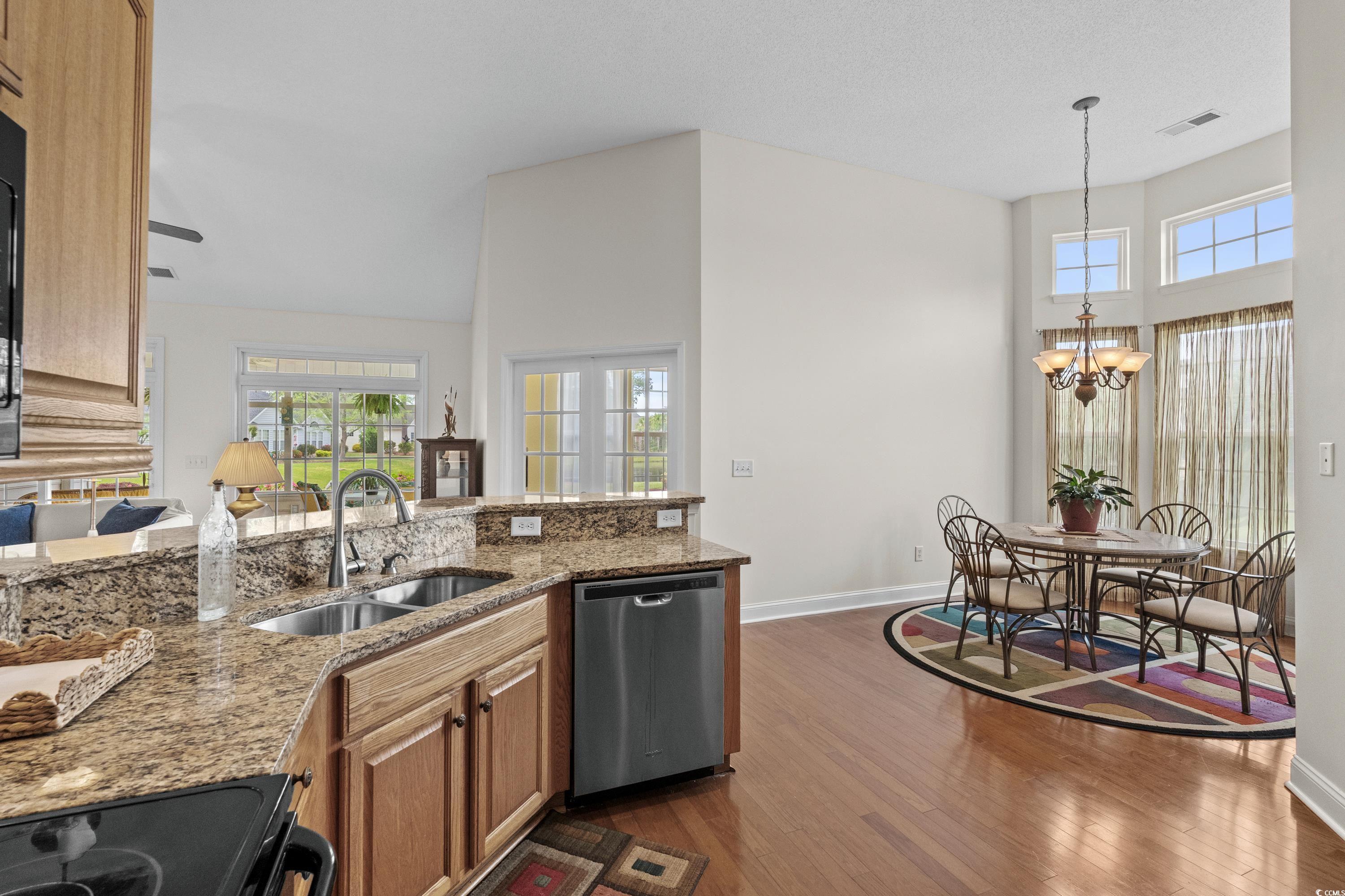 5025 Westwind Drive Myrtle Beach, SC 29579 - Photo 17 of 36 Kitchen with stainless steel dishwasher, light sto