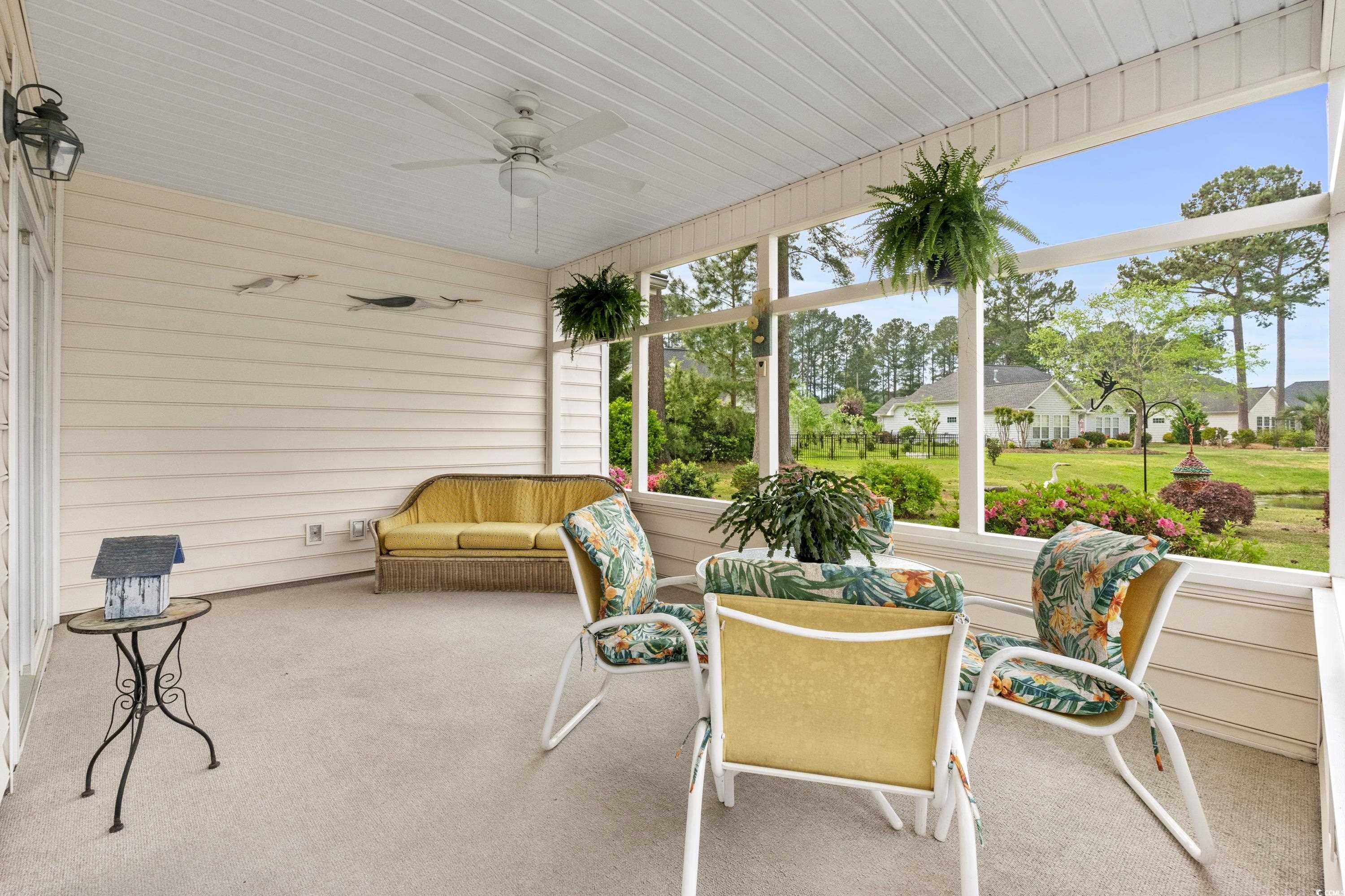 5025 Westwind Drive Myrtle Beach, SC 29579 - Photo 23 of 36 Sunroom / solarium featuring a ceiling fan
