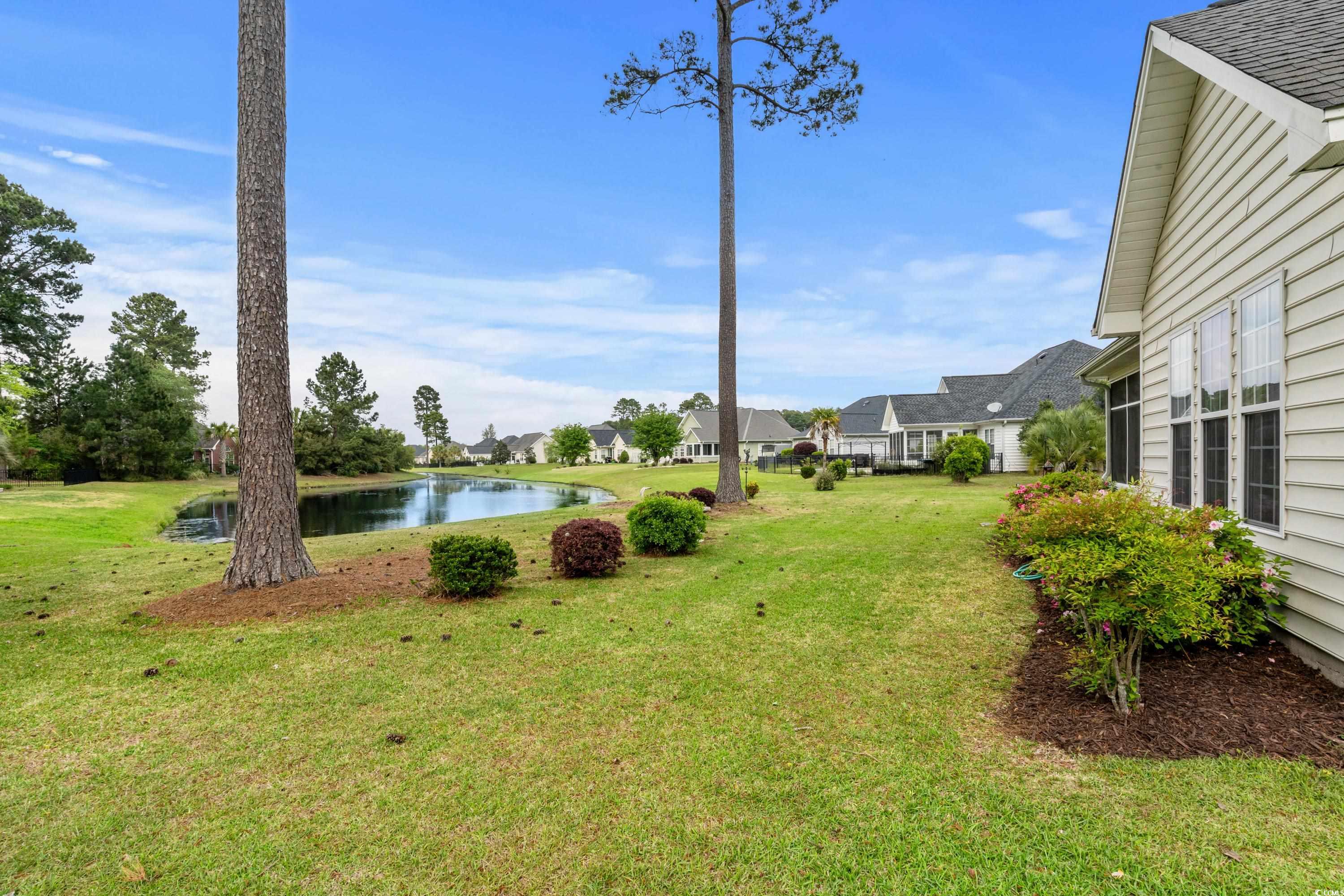 5025 Westwind Drive Myrtle Beach, SC 29579 - Photo 26 of 36 View of yard featuring a water view and a resident