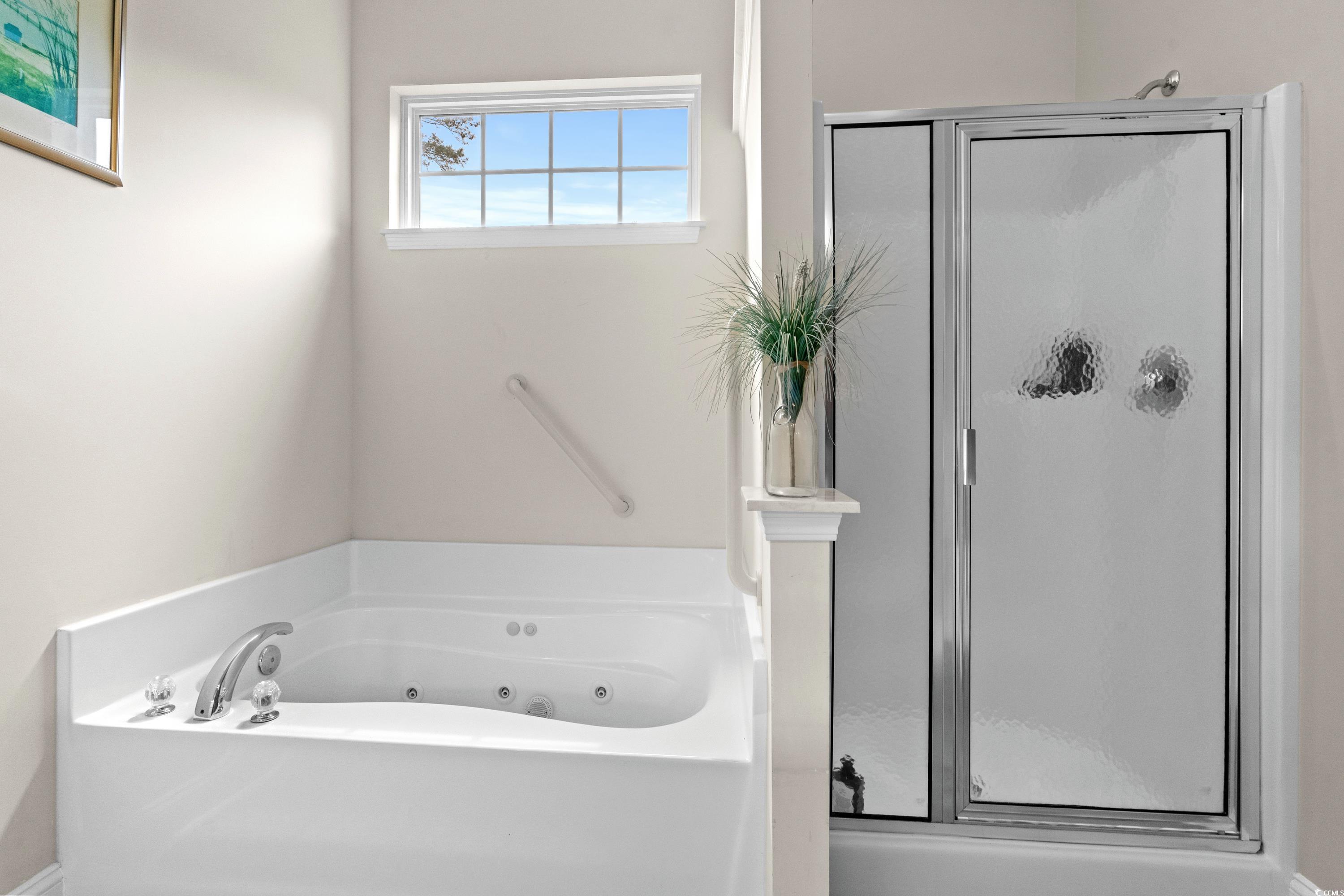 5025 Westwind Drive Myrtle Beach, SC 29579 - Photo 31 of 36 Full bathroom with a shower stall and a jetted tub